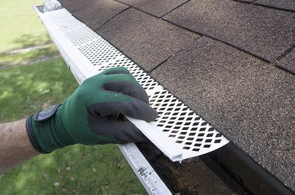 gutter guards typically require less frequent cleaning and maintenance compared to traditional open gutters